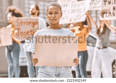 Protest, sign and mockup with a black woman activist holding cardboard during a rally or demonstration. Poster, freedom and politics with a young female fighting for human rights or equality