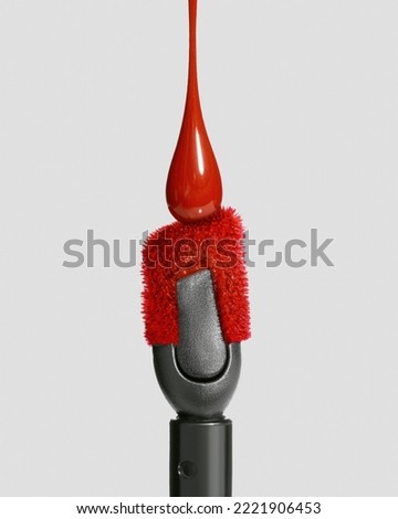 Red drop of liquid lipstick falls on applicator. Closeup shot of colorful brush liquid lipstick                               