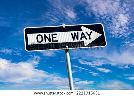 One way sign against sky in New York City, NY, USA