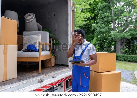 Delivery house move cargo truck service man hold flannel remove sweat from face on summer day
