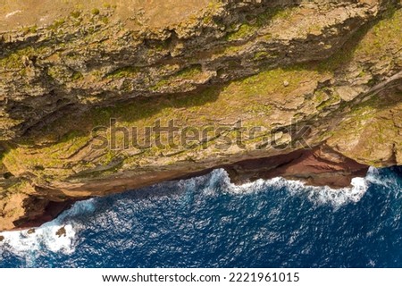 Drone photography of cliff and sea during summer day