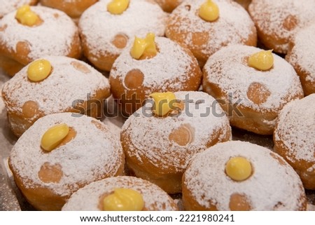 Decorative donuts on in a Jerusalem bakery during the celebration of the Jewish holiday of Hanukkah, when it is traditional to eat foods fried in oil.  