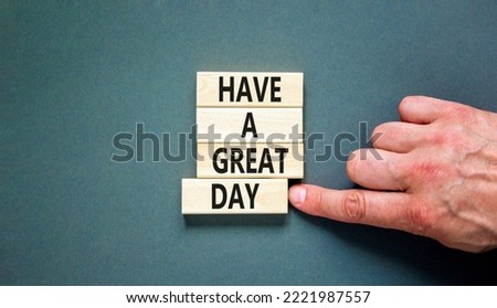 Have a great day symbol. Concept words Have a great day on wooden blocks. Beautiful grey table grey background. Businessman hand. Business, psychological Have a great day concept. Copy space.