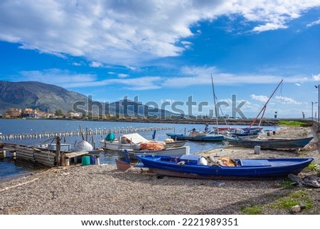 Famous island - fishing village of Aitoliko in Aetolia - Akarnania, Greece situated in the middle of Messolongi archipelago known as the Little Venice of Greece Royalty-Free Stock Photo #2221989351