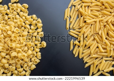 Beautiful pasta background with penne and ravioli. Close-up