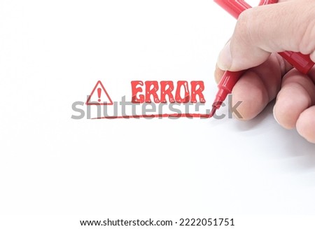 hand writing a text with red marker on white background. Error concept, take decisions, bug sistem,