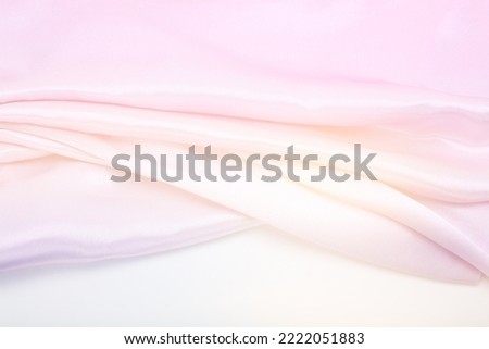 Pink, beige nacre wave fabric silk. Abstract texture horizontal smoke copy space background.