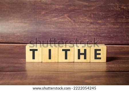 Tithe - words from wooden blocks with letters, one-tenth part tax to the Church tithe concept,