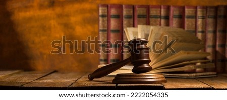 Law and justice concept. Mallet gavel of the judge, scales of justice, books. Copy space for text.