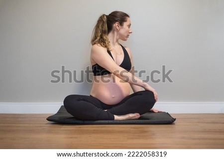 Pregnancy exercises - Torso rotation Royalty-Free Stock Photo #2222058319