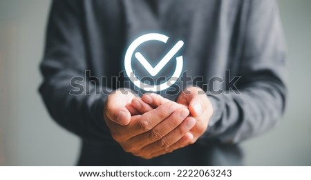 Businessman Hand shows the sign of the top service the best Quality assurance, Guarantee, Standards, ISO certification and standardization concept. guarantee product and ISO service concept.	