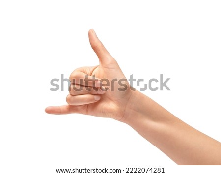 Woman hand in shaka or calling gesture on a white isolated background Royalty-Free Stock Photo #2222074281