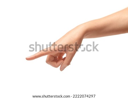 Female hand points a finger isolated on white background. Royalty-Free Stock Photo #2222074297