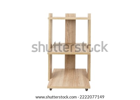 Cabinet or rack on wheels with shelves on a white isolated background. Wooden chipboard.