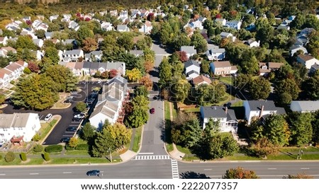 Aerial view of upscale residential area, gated community street real estate with single family homes. Autumn sunny day. Royalty-Free Stock Photo #2222077357