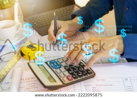 Project engineers calculate construction costs.,Cost of materials and labor for construction,financial business Royalty-Free Stock Photo #2222095875