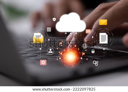 a laptop connected to a cloud computing technology network. Online gadgets enter information and data into a database marked by a company icon.