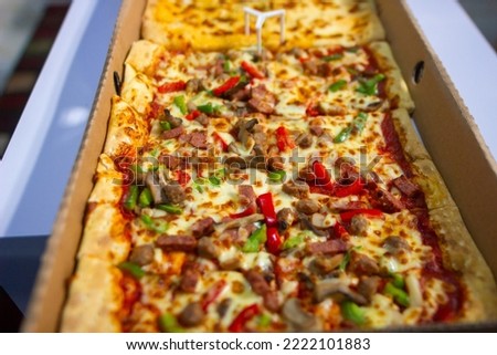 Close up pizza on a white table. Selective focus pizza Royalty-Free Stock Photo #2222101883