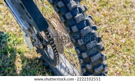 Close up of a motor bike's back tyre.