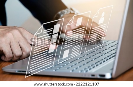 Online document database and document management system concept. businessman working on laptop with virtual screen Automated processes to manage files efficiently