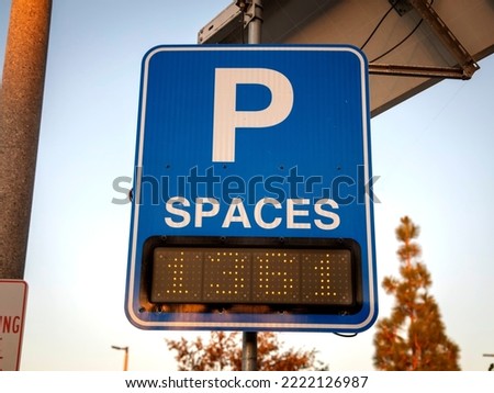 Blue sign stating how many parking spaces are available 