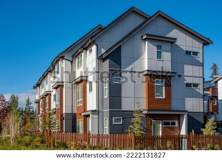 Beautiful Home Exterior design of residential fronts that are varied and interesting to look at. Neighborhood new modern houses in Vancouver. Canadian modern residential architecture. Street photo