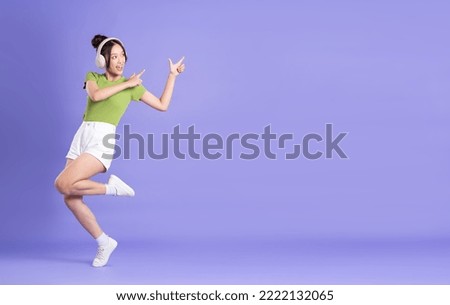 full body image of beautiful asian girl posing on pink background Royalty-Free Stock Photo #2222132065