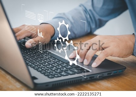Person working on computer laptop. automation, industrial business process workflow optimisation concept on virtual digital screen. Automation Software Technology Process System Business concept. Royalty-Free Stock Photo #2222135271