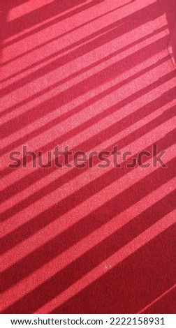 Shadows on the red carpet