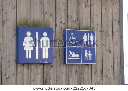 wc Toilet sign men women  icon on wooden building facade water closets wall entrance
