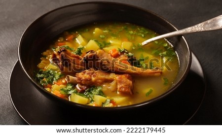 Pea soup with smoked pork ribs served in plate
