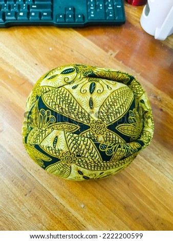Javanese traditional cap on the wooden table