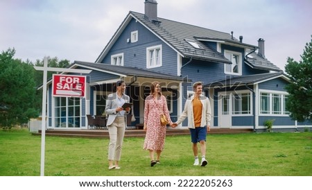 Excited Young Couple Chatting with Happy Real Estate Agent. Businesswoman Talking About the House with Young Man and Pregnant Female. Standing on a Lawn Next to For Sale Sign on a Warm Day.