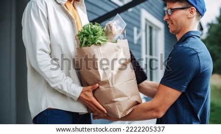 Grocery Delivery Company Employee Bringing a Bag Full of Fresh Vegetables and Other Food Items to a Residential Area Home. Young Homeowner Opens the Door to receive the Ordered Parcel.