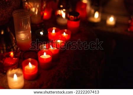 Groupl of candlelighs at All Saint's Day background Royalty-Free Stock Photo #2222207413