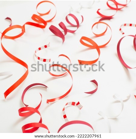 birthday background with red serpentine on white Royalty-Free Stock Photo #2222207961