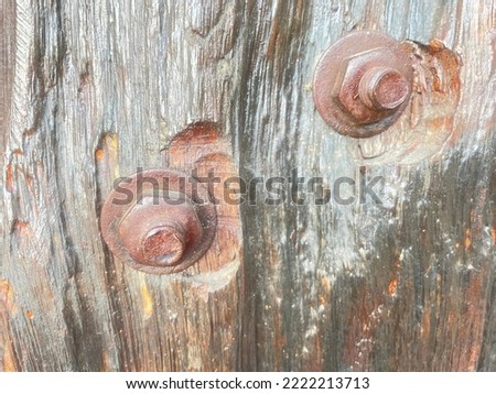 Embed Hexagon Bolts Old Knotted Weathered Rotten Cracked Wooden Rustic Floorboard Coarse Red Vignetted Grunge. Fragment of an old knotty wooden planks background collections.
