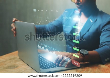 Business people touch graphics technology To analyze the income of the organization Through the laptop of the overall picture of the year Business assessment ideas in 2023	
