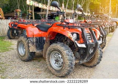 ATV  is a vehicle that can go anywhere. It is a car with a motorcycle designed to be small. and has four wheels for off-road use. Soft and selective focus.                                   Royalty-Free Stock Photo #2222228289