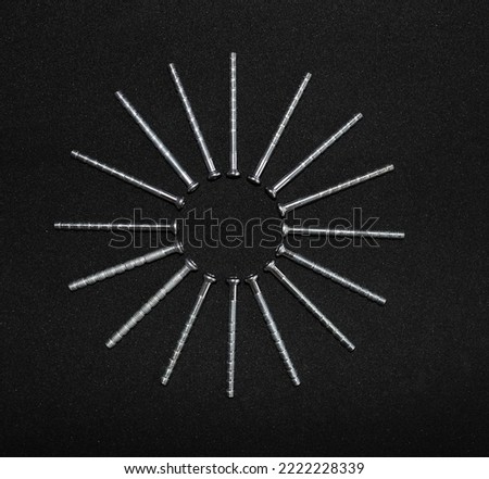 Furniture Fasteners. Interrupted Thread Bolts Laid Out In A Shape Of Star Top View Stock Photo
