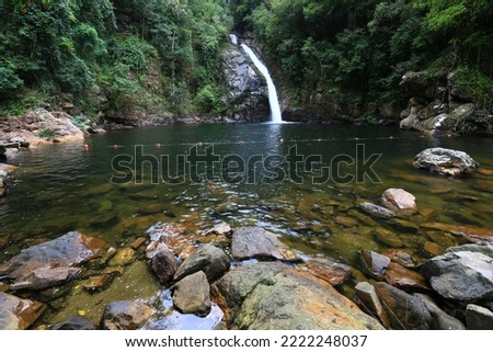 Nakhonsrithamarat,Thailand,Woman relax and happy time on Yong waterfall in sunny day,unseen place in Nakhon Si Thammarat province, south Thailand Royalty-Free Stock Photo #2222248037