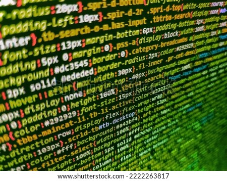 Real Html code developing screen. Programming code abstract background screen of software. Simple website HTML code with colorful tags in browser view on dark background. Software engineer at work