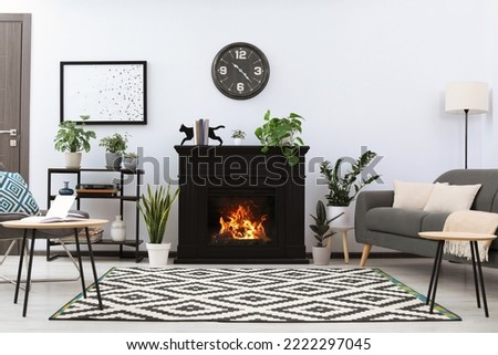 Stylish living room interior with fireplace and comfortable sofa