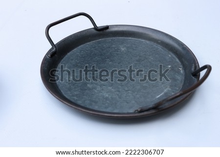 View of serving plate for fruit made of metal Isolated on white background. Selective Focus blurry background 