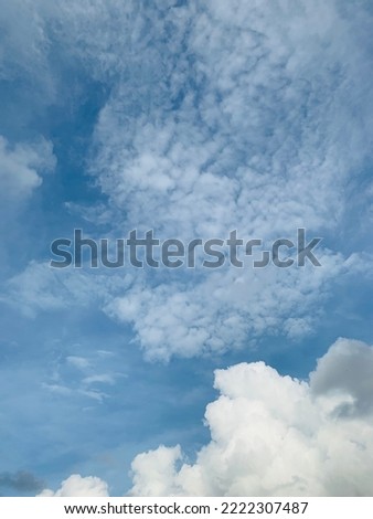 Stratocumulus clouds formation in a mid blue sky atmospheric beauty in nature at Bangkok, Thailand.no focus