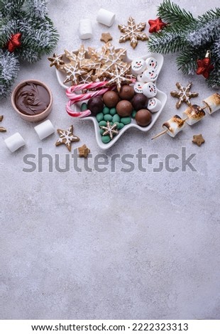 Christmas plate with snacks and sweets, cookies and marshmallow