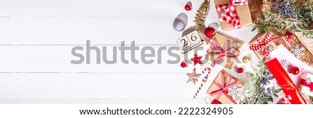 Boxing day sale seasonal promotion background. Various presents gift box with ribbon, with inscription frame Boxing day, block wooden calendar, wrapping holiday paper, Christmas decor, ribbons Royalty-Free Stock Photo #2222324905