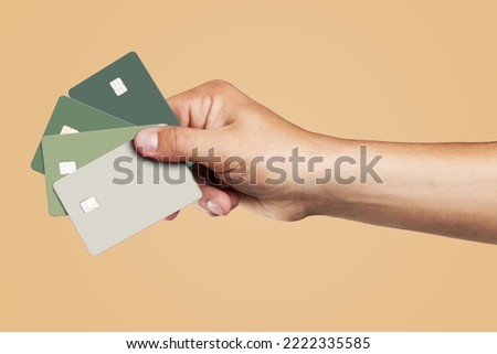 Template of several credit cards in the man's hand.  Royalty-Free Stock Photo #2222335585