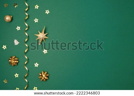 New Year Green Background. Golden Decoration. Christmas Greeting Card Mockup. Sparkle Baubles. Top view, Copy Space. Gold Balls, Confetti on Dark Green Festive Backdrop. Banner Template. Xmas Frame.