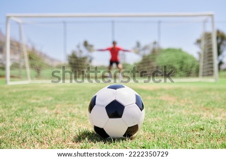 Soccer ball, football field and goalkeeper ready for defense to stop goals for penalty kick game on soccer field, grass pitch and sports stadium. Football player, goalie challenge and target training Royalty-Free Stock Photo #2222350729